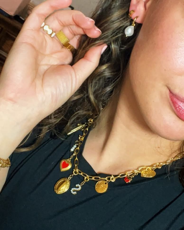 The TRIPLE PEARL charm necklace features three delicate pearls on a sleek gold chain, ideal for elegant styling | Lolo Jewelry.